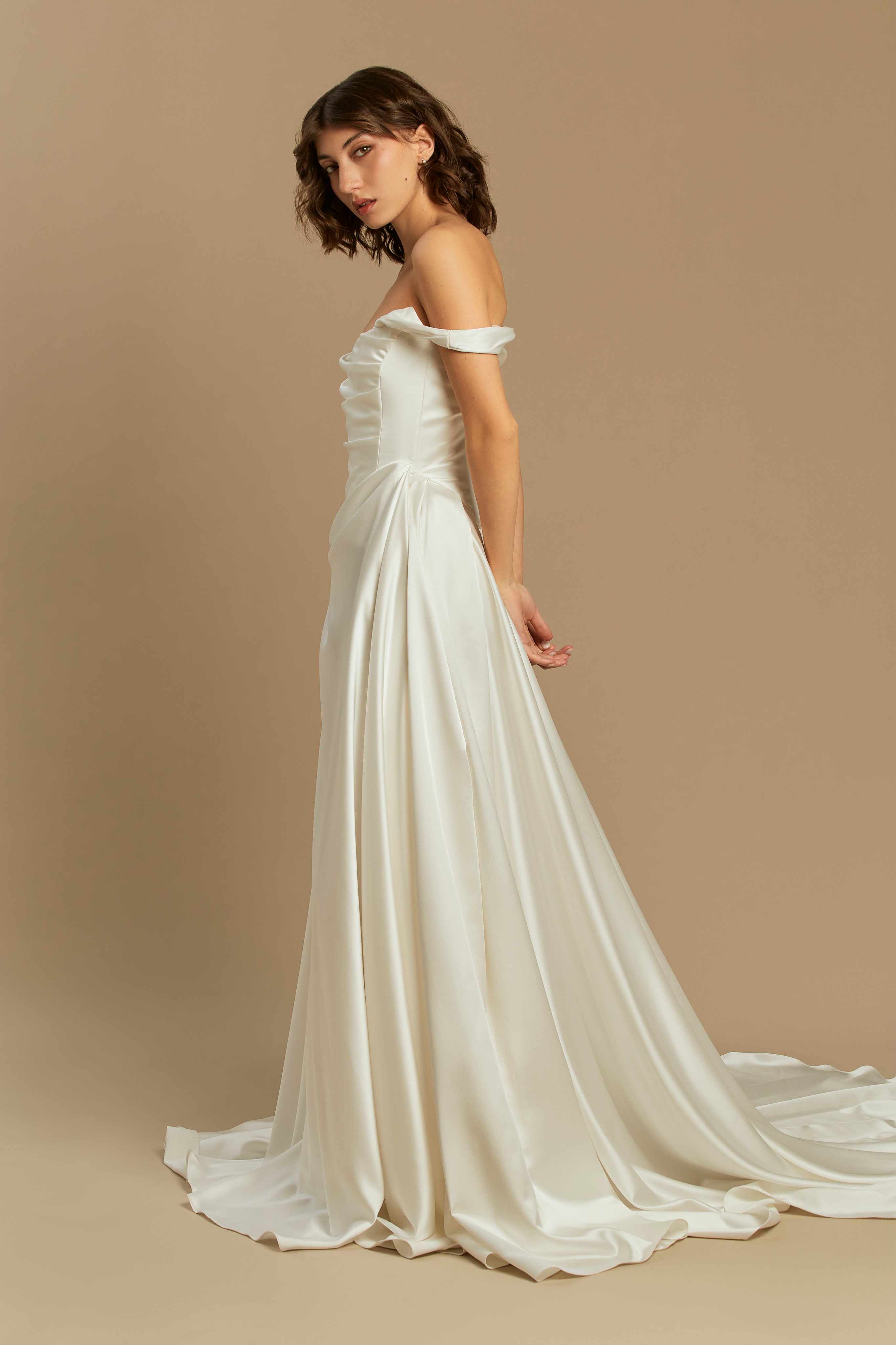 Caroline | Silk Satin Gown with Pleated Skirt and Train wedding dress by Rouvell — side view