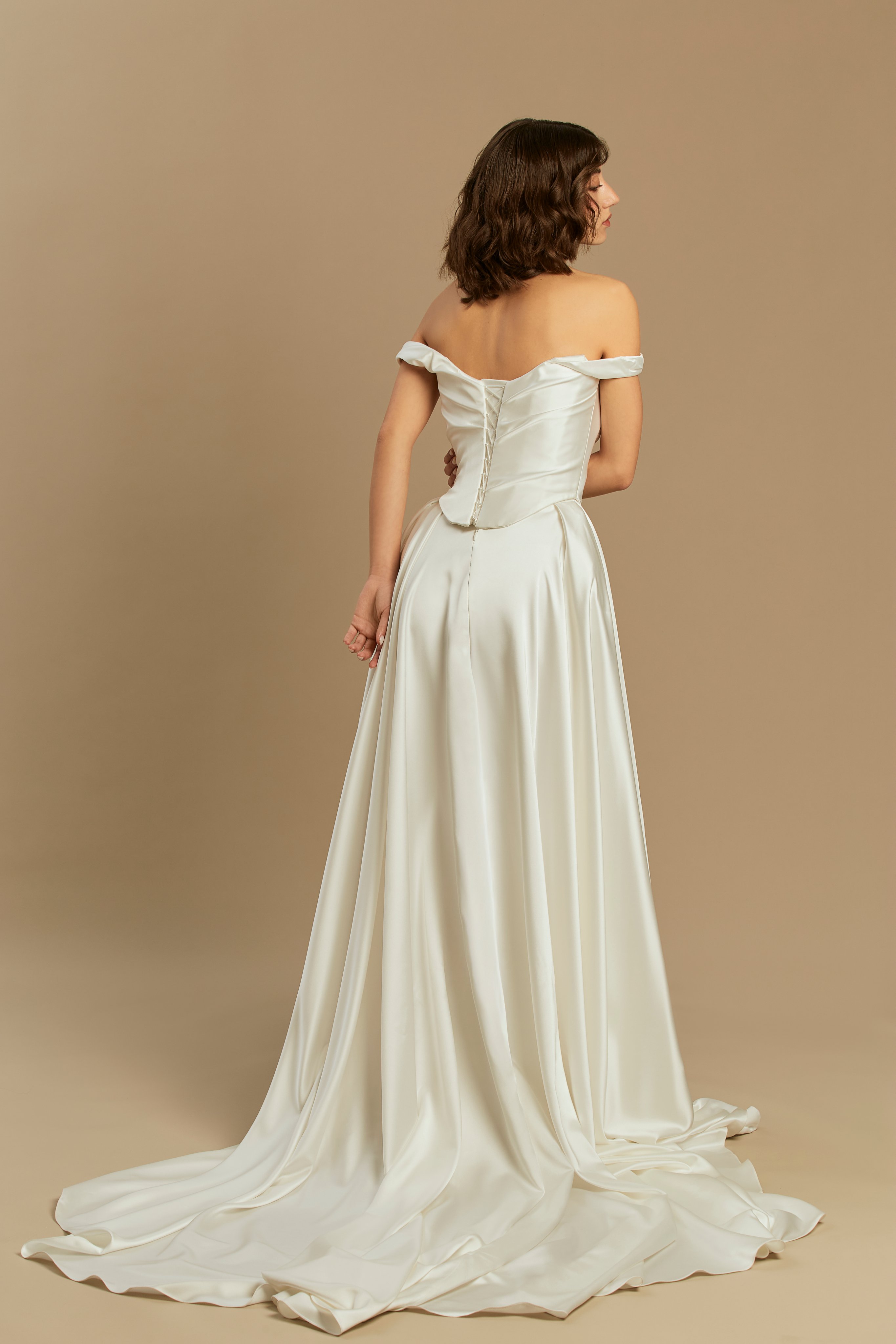 Caroline | Silk Satin Gown with Pleated Skirt and Train wedding dress by Rouvell — back view